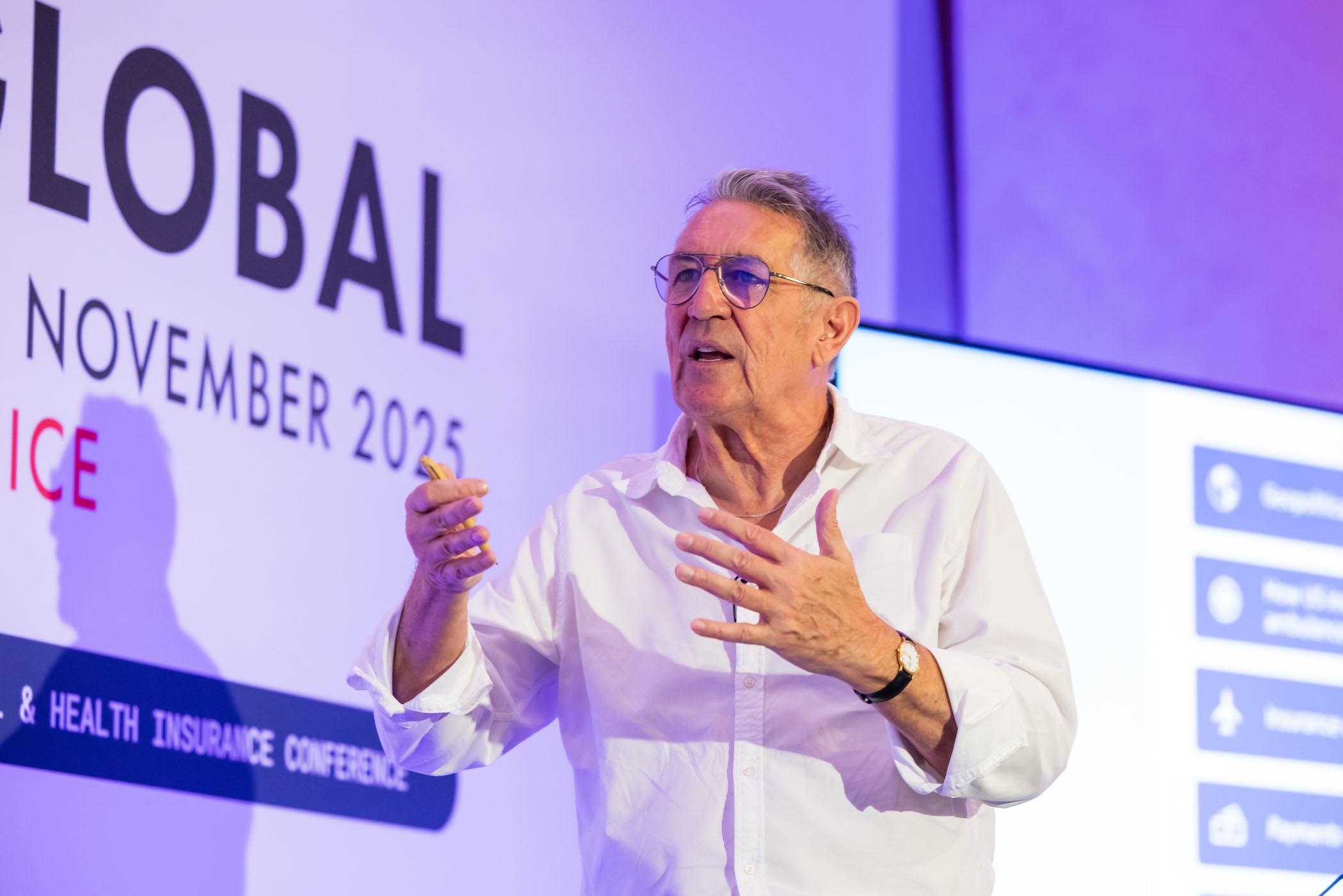 Speaker presenting at an international travel and health insurance conference